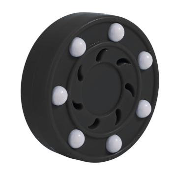 Hockey puck ball for outdoor use