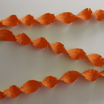 Frayed orange crepe paper streamer - 24 metres