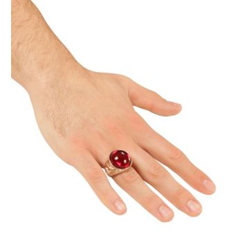 Gold-coloured ring with red stone